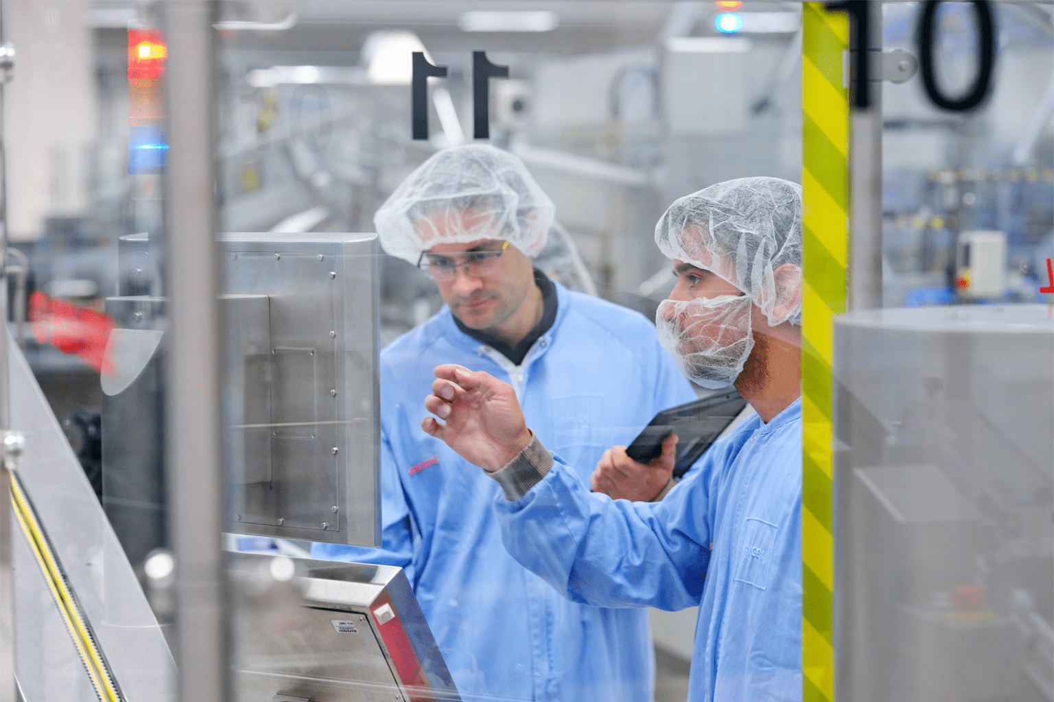 Employee using AI-driven technology at Amgen’s production facility in Breda