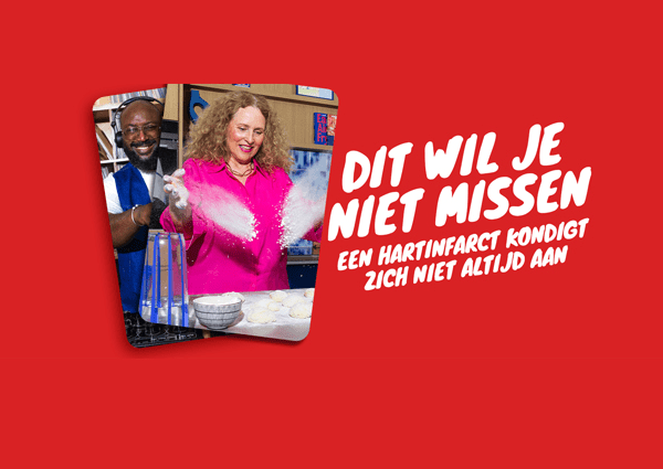 A woman prepares food in a kitchen. The campaign message reads: “Dit wil je niet missen. Een hartinfarct kondigt zich niet altijd aan.”