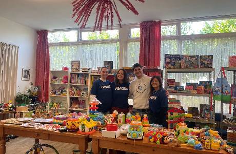 A-group-of-Amgen-colleagues-stands-in-a-space-filled-with-colourful-toys-ready-to-bring-joy-to-children-and-parents-at-Vincentius-thumbnail